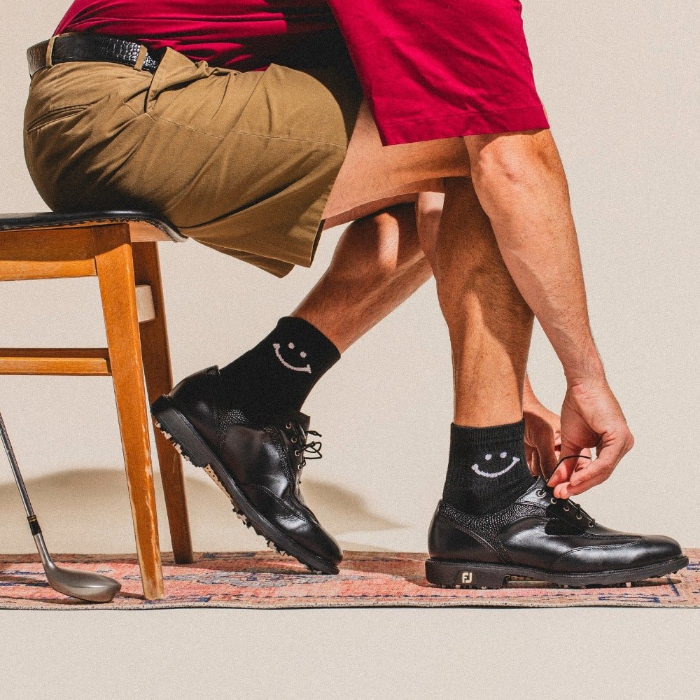 Del Campo Night Mode Pack golf socks featuring all four Night Mode designs: bolt, palm, smiley, and 1776