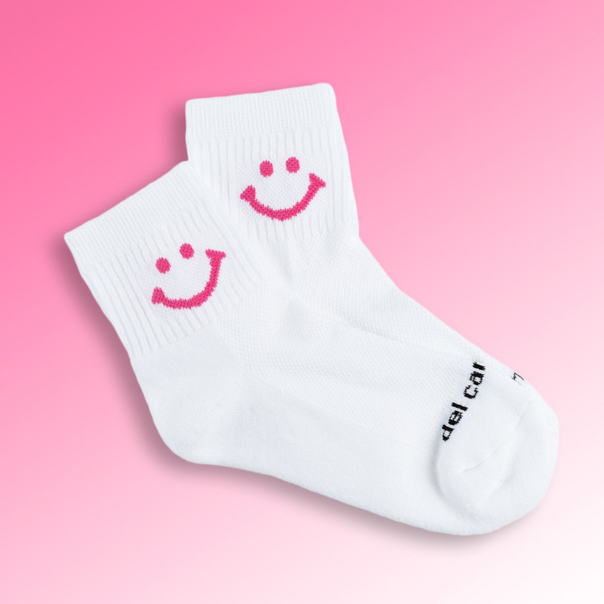 Del Campo Golf white crew socks with hot pink smiley face design | product