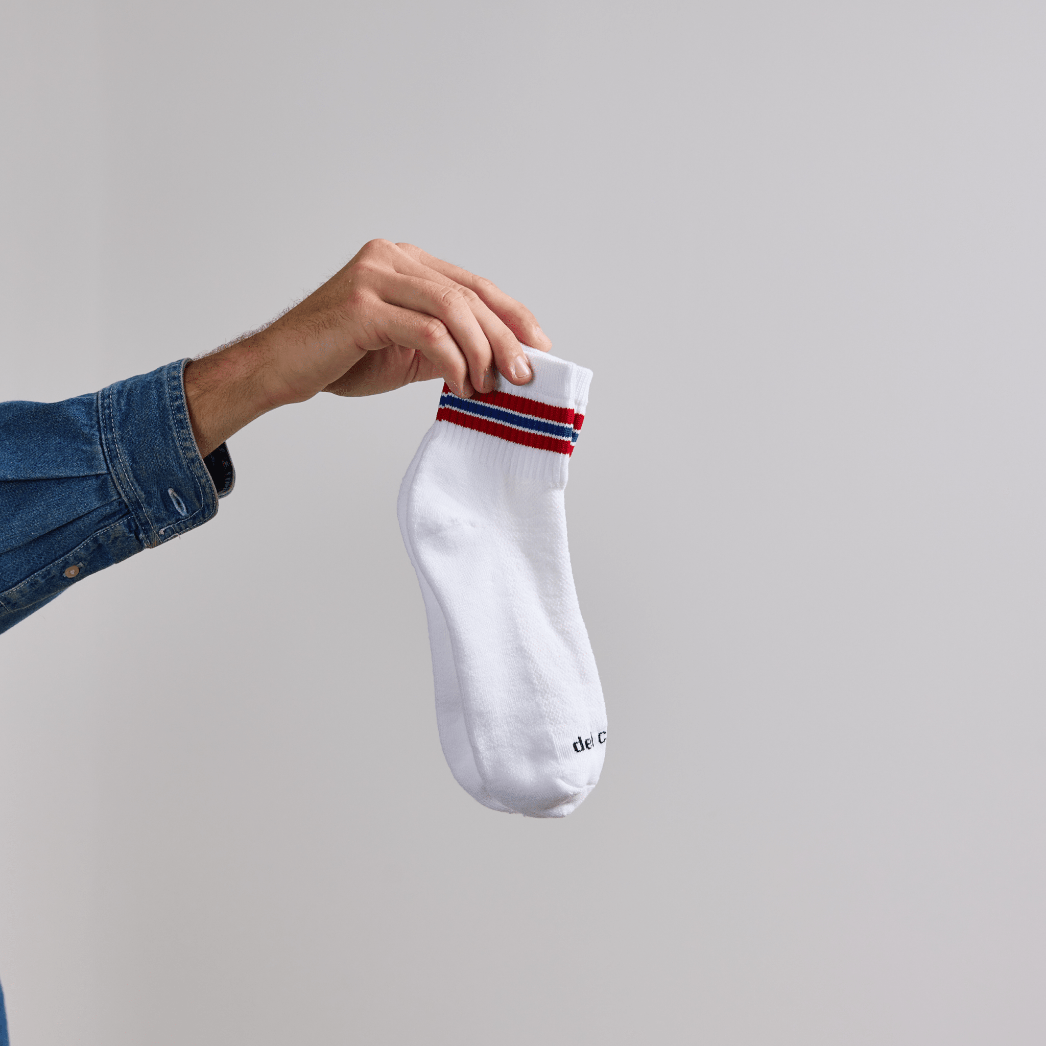 Del Campo Red/Blue Triple Stripe golf socks, lifestyle shot