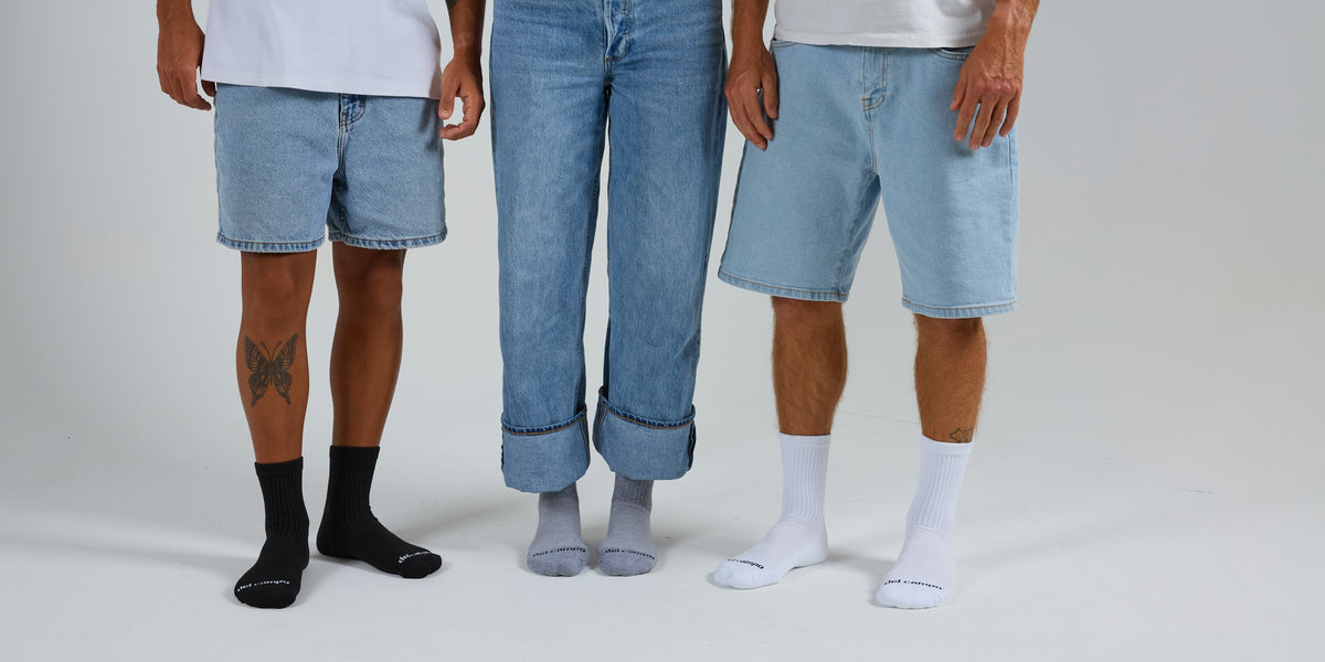 Black, grey and white Del Campo blank socks side by side