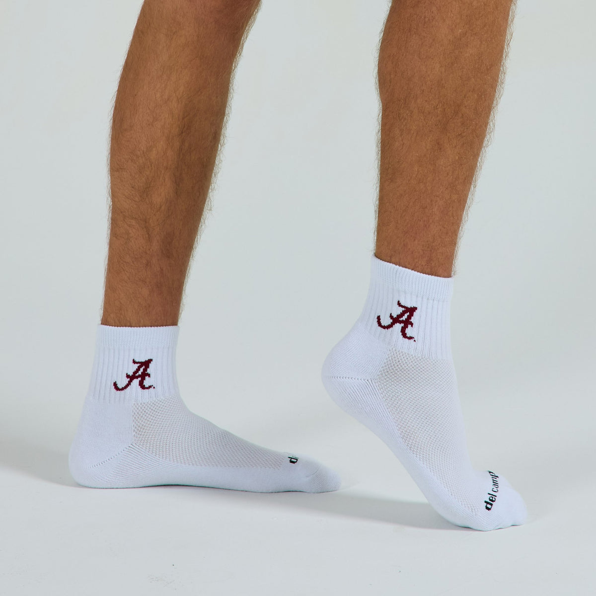 Del Campo Alabama Crimson Tide golf socks on a male model in studio