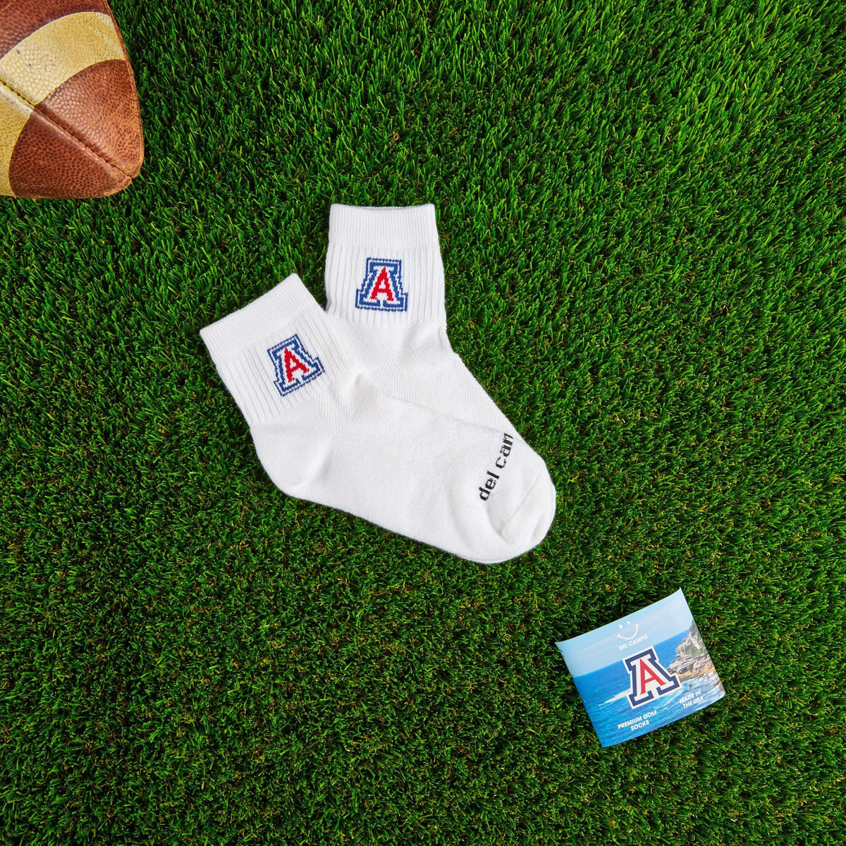 Del Campo Arizona Wildcats golf socks on turf with a team pennant