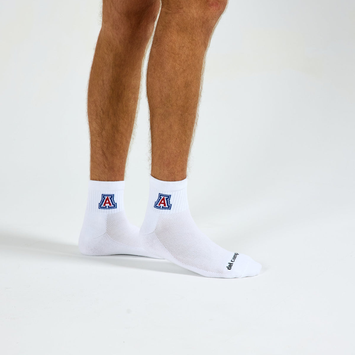 Man wearing Del Campo Arizona Wildcats golf socks, studio shot, no shoes