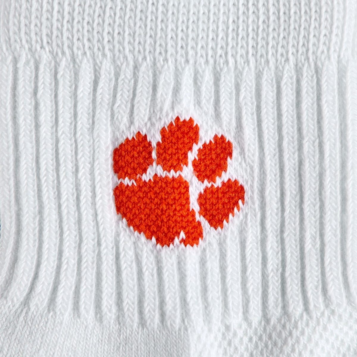 Close-up of the orange tiger paw on Del Campo Clemson Tigers golf socks