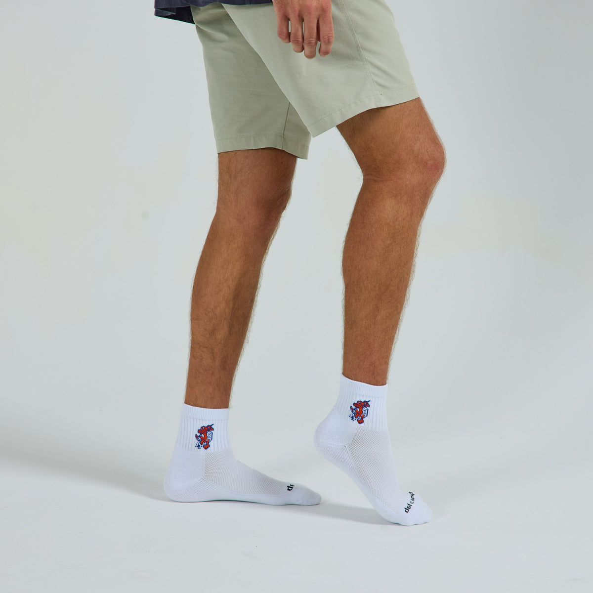 Del Campo Florida Gators Swinging Gator golf socks on a male model in studio