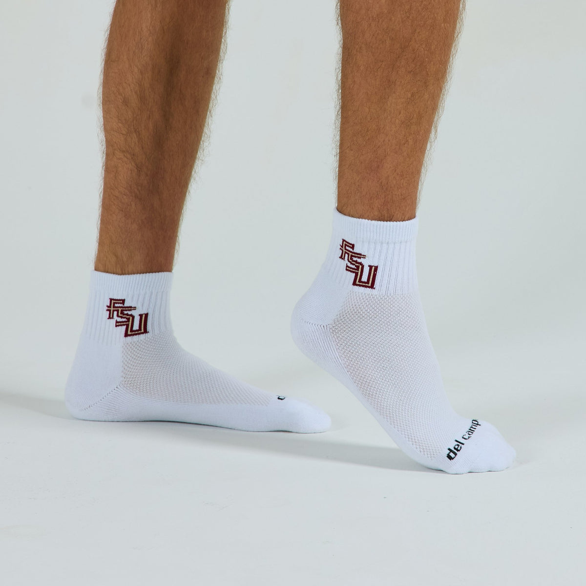 Man wearing Del Campo Florida State Script golf socks, studio shot, no shoes