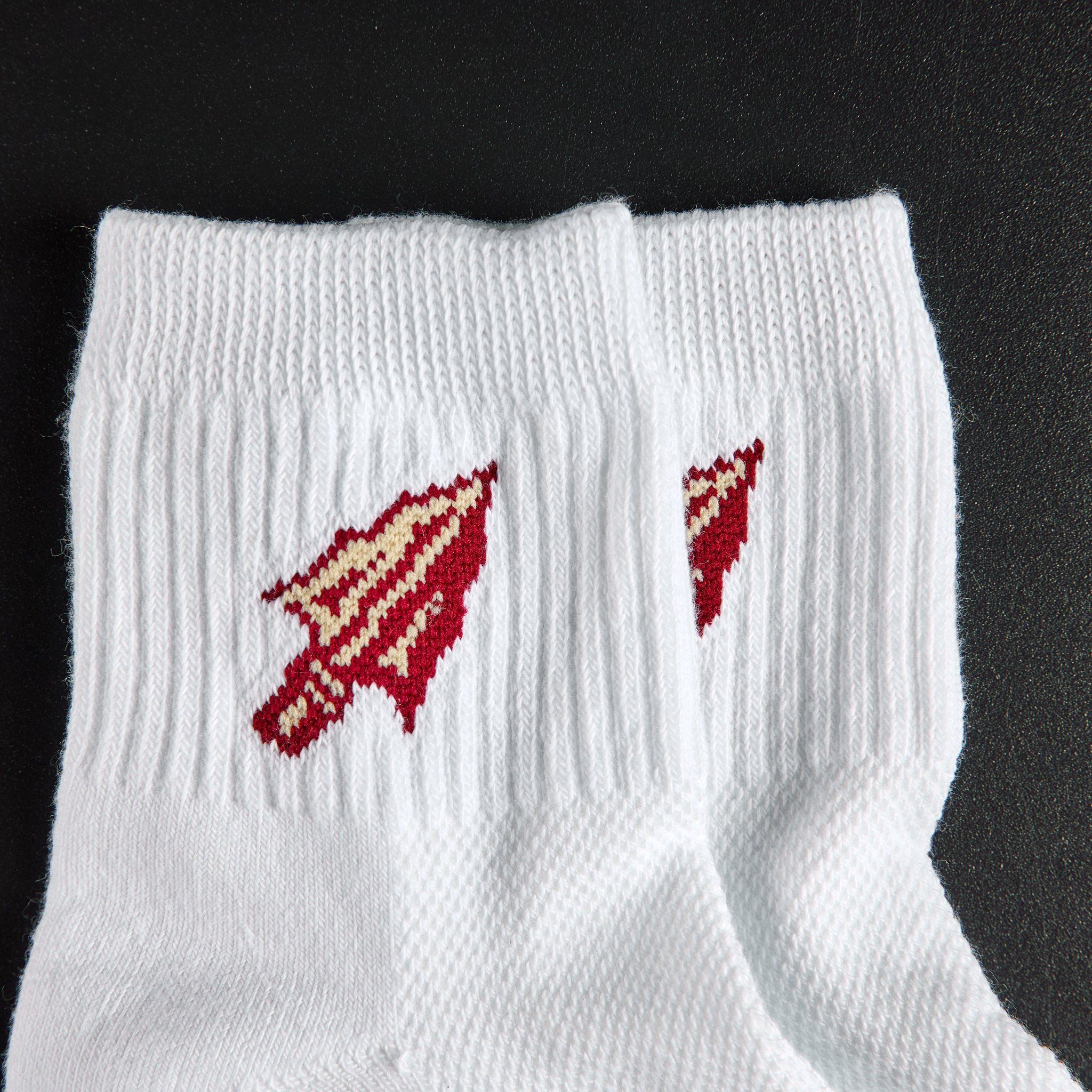 Close-up of the spear-arrowhead on Del Campo Florida State Spear golf socks