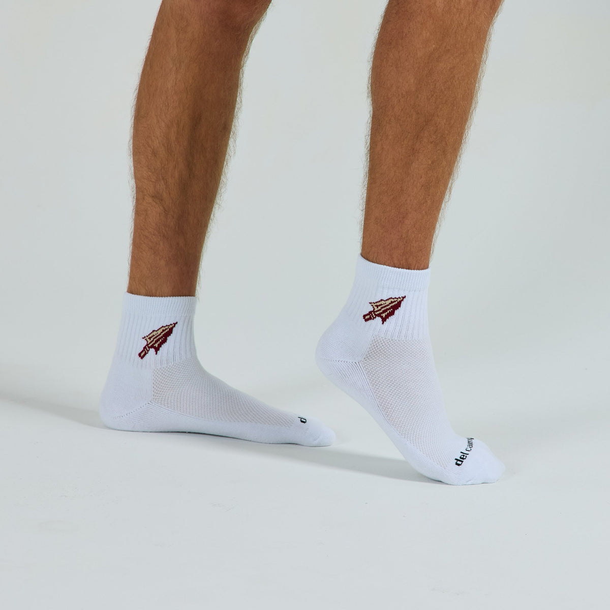 Del Campo Florida State Spear golf socks on a male model in studio