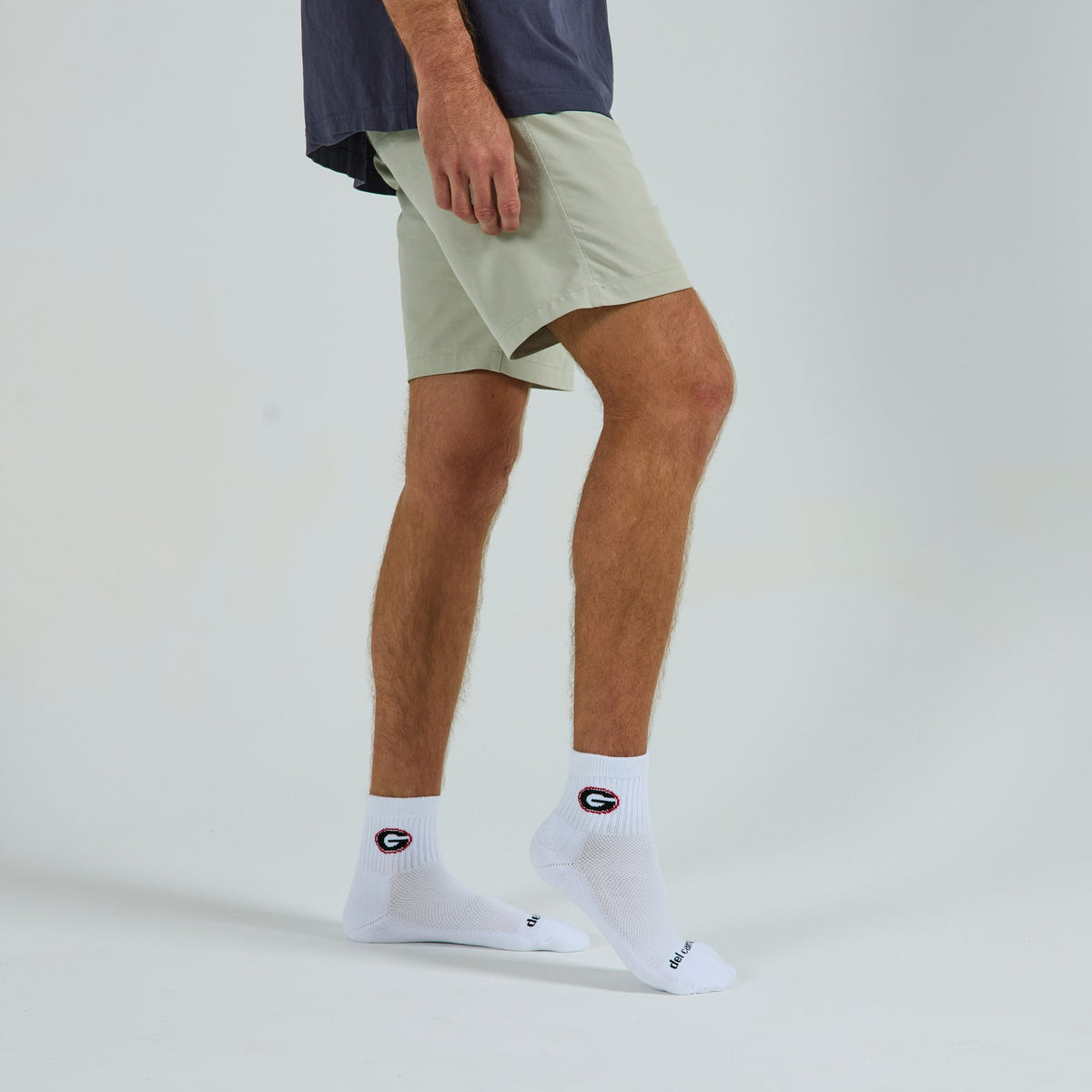 Del Campo Georgia Bulldogs golf socks on a male model in studio