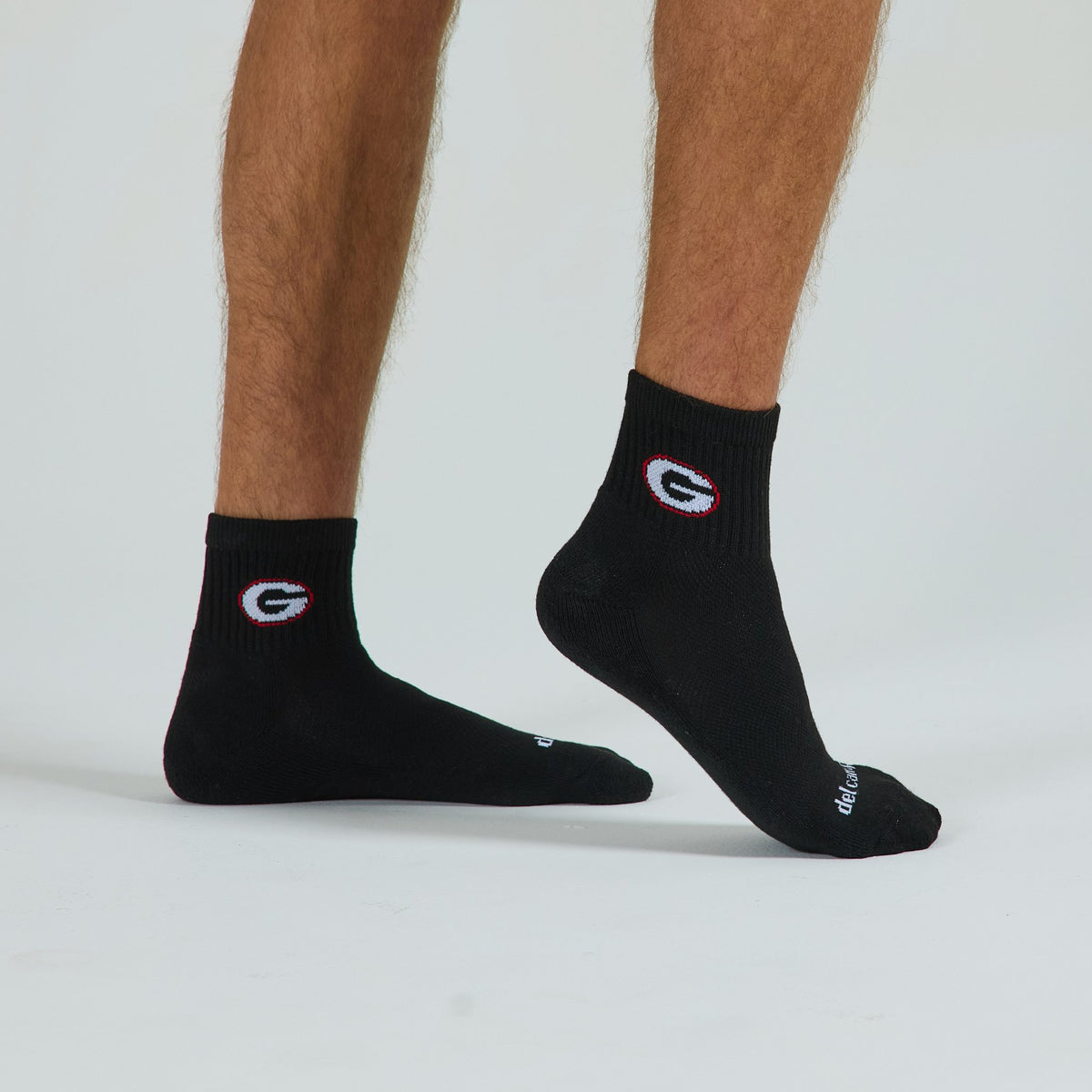 Man wearing Del Campo Georgia Night Mode golf socks, studio shot, no shoes