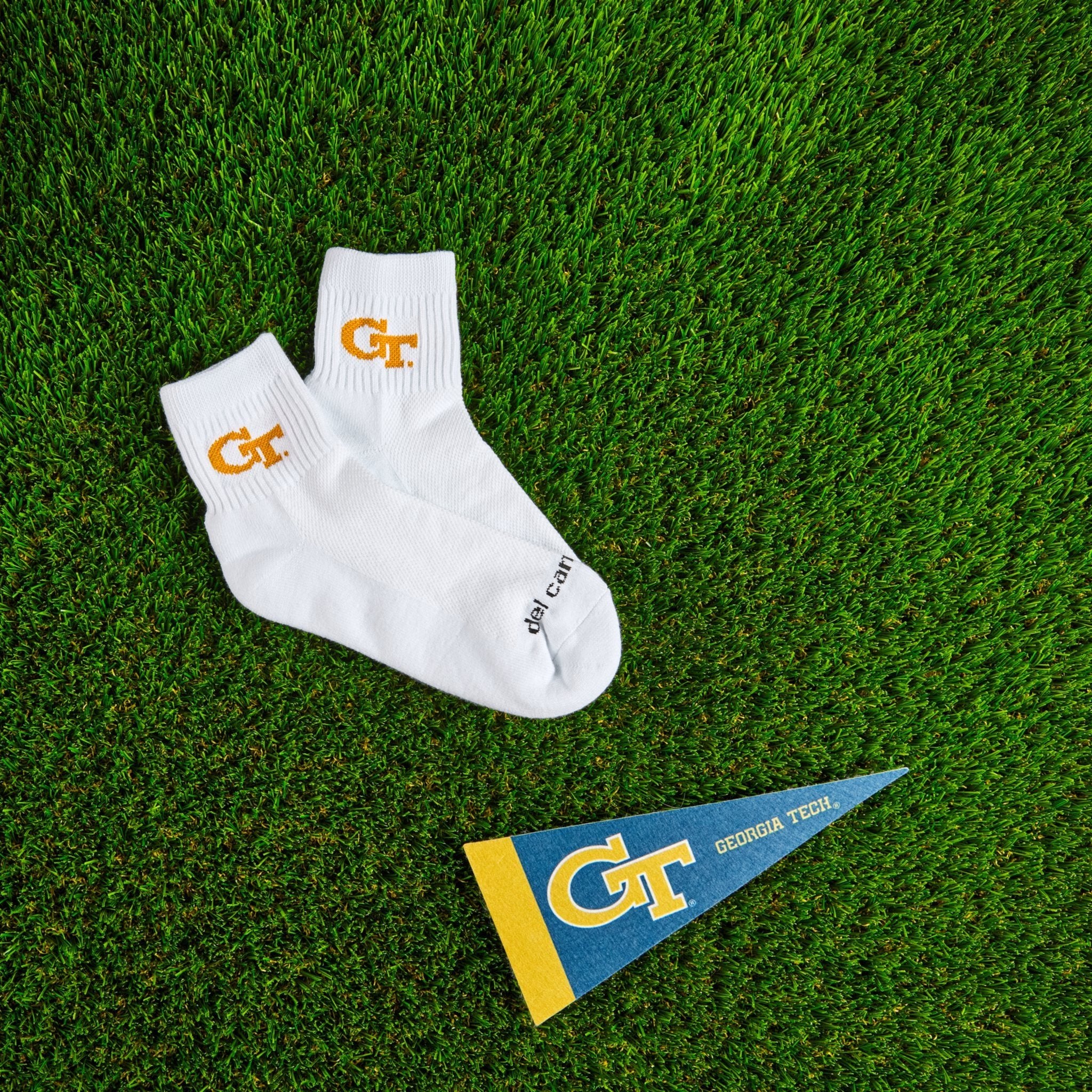 Del Campo Georgia Tech GT golf socks on turf with a team pennant