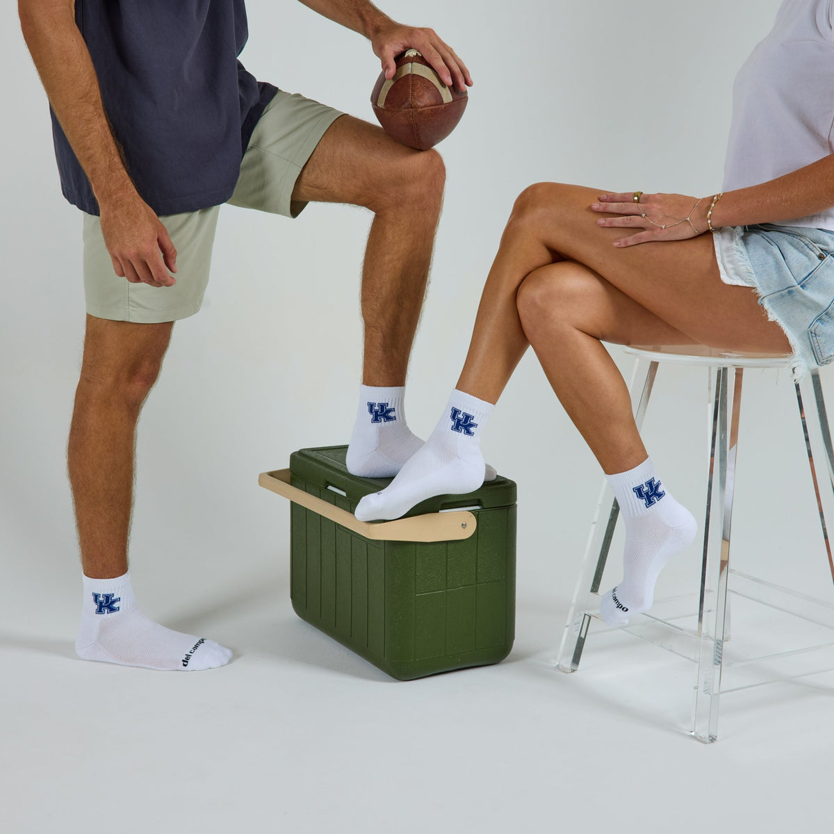 Two models wearing Del Campo Kentucky Wildcats golf socks in studio