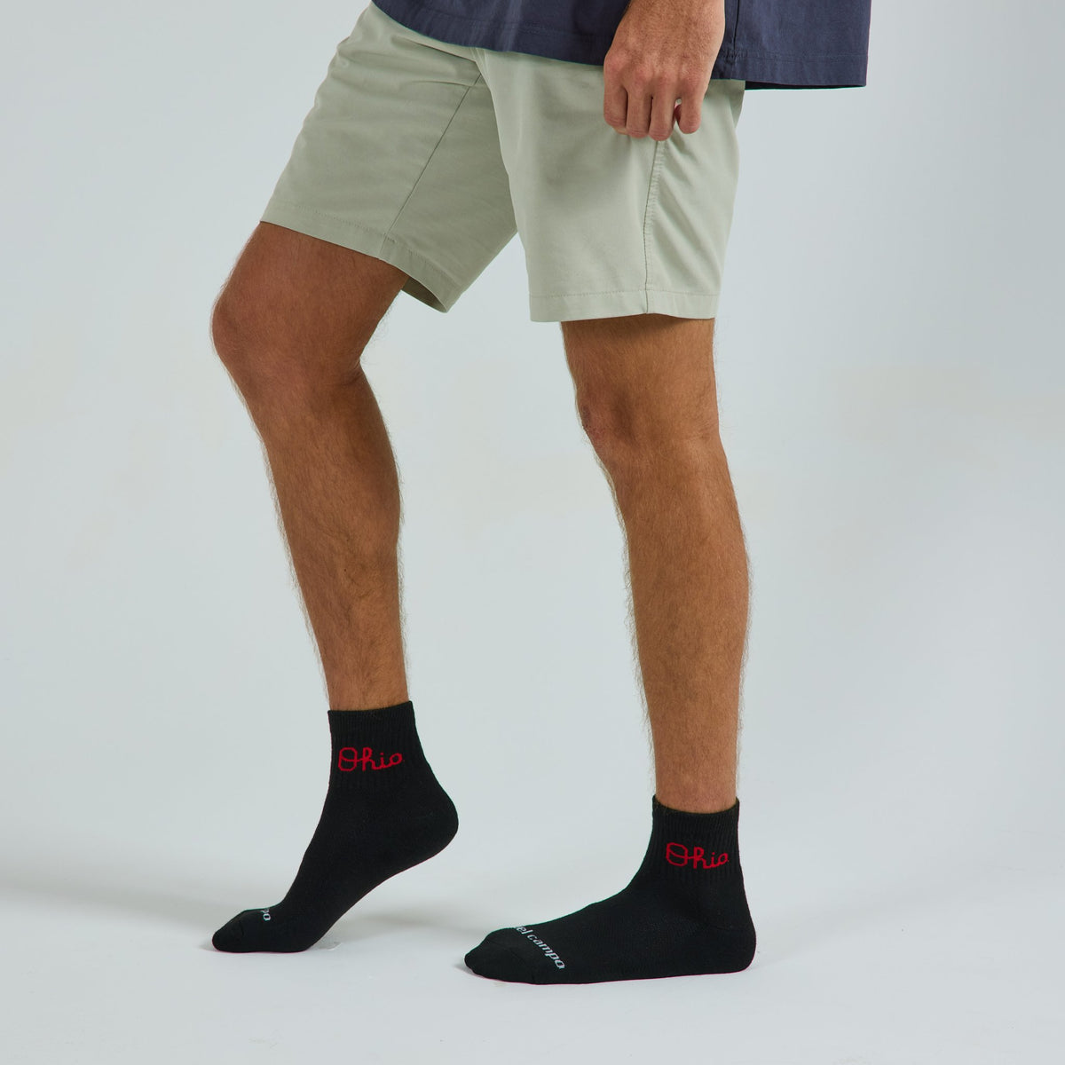 Del Campo Ohio State Night Mode golf socks on a male model in studio