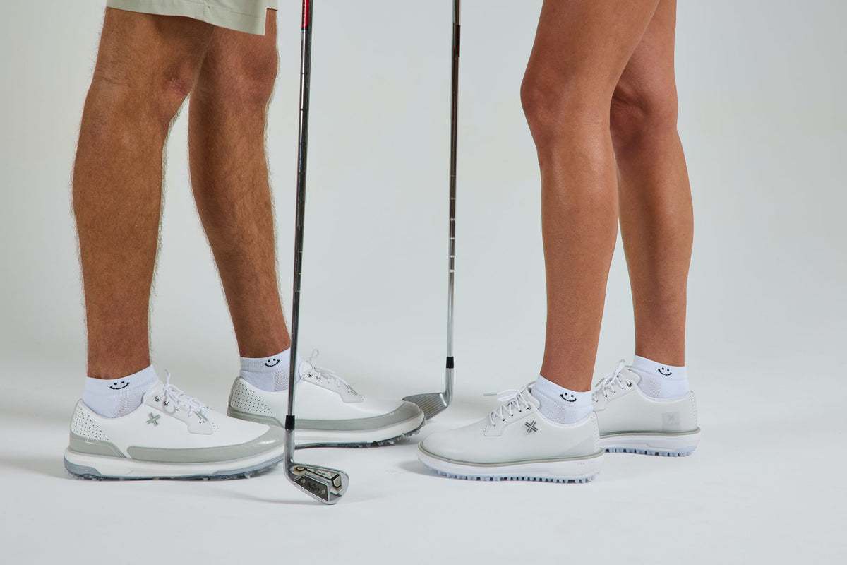 Smiley Lowcut Socks on two golfers in white golf shoes - del campo