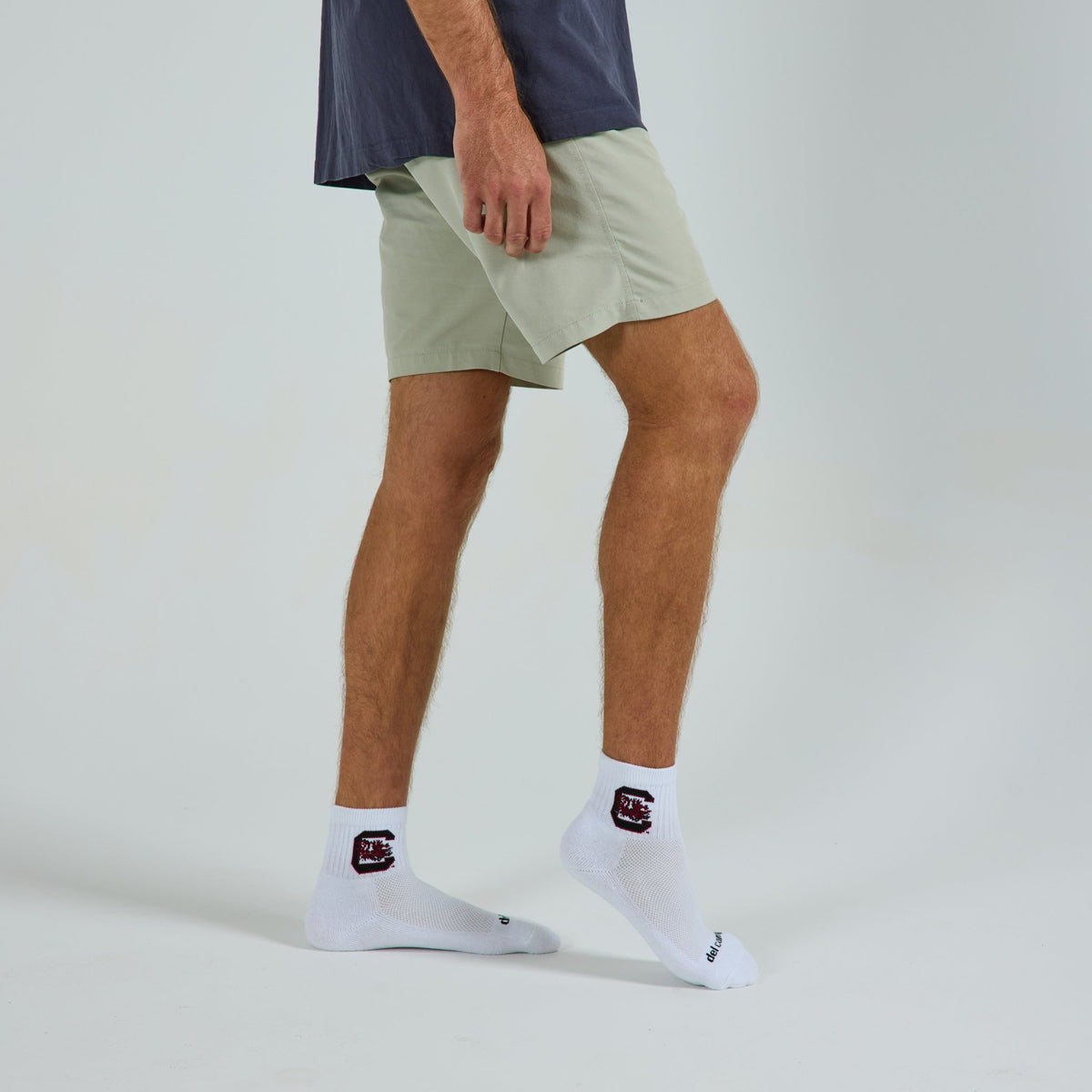 Man wearing Del Campo South Carolina Gamecocks golf socks, studio shot, no shoes