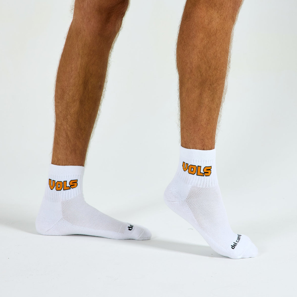 Man wearing Del Campo Tennessee Block golf socks, studio shot, no shoes