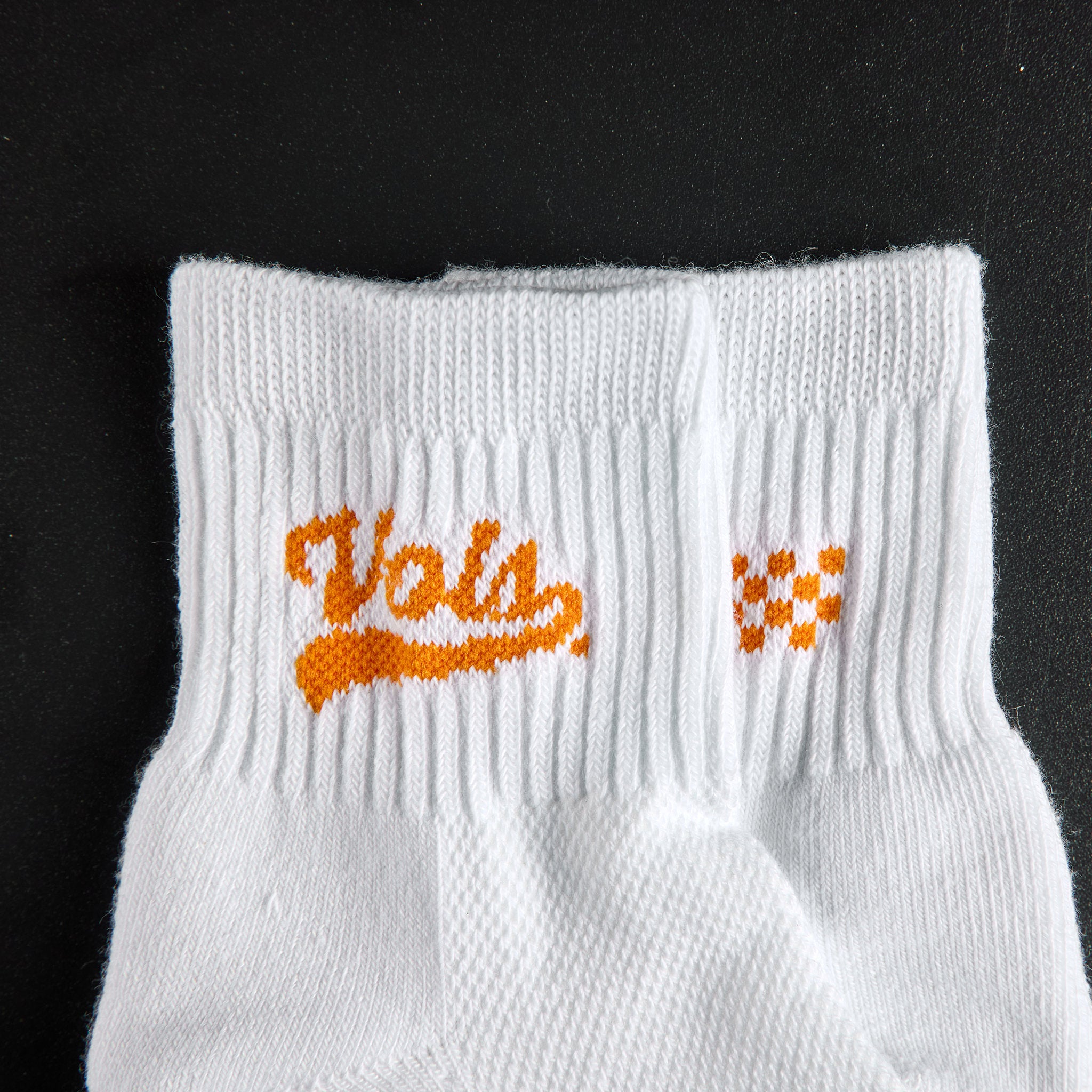 Close-up of the Vols script wordmark on Del Campo Tennessee Script golf socks