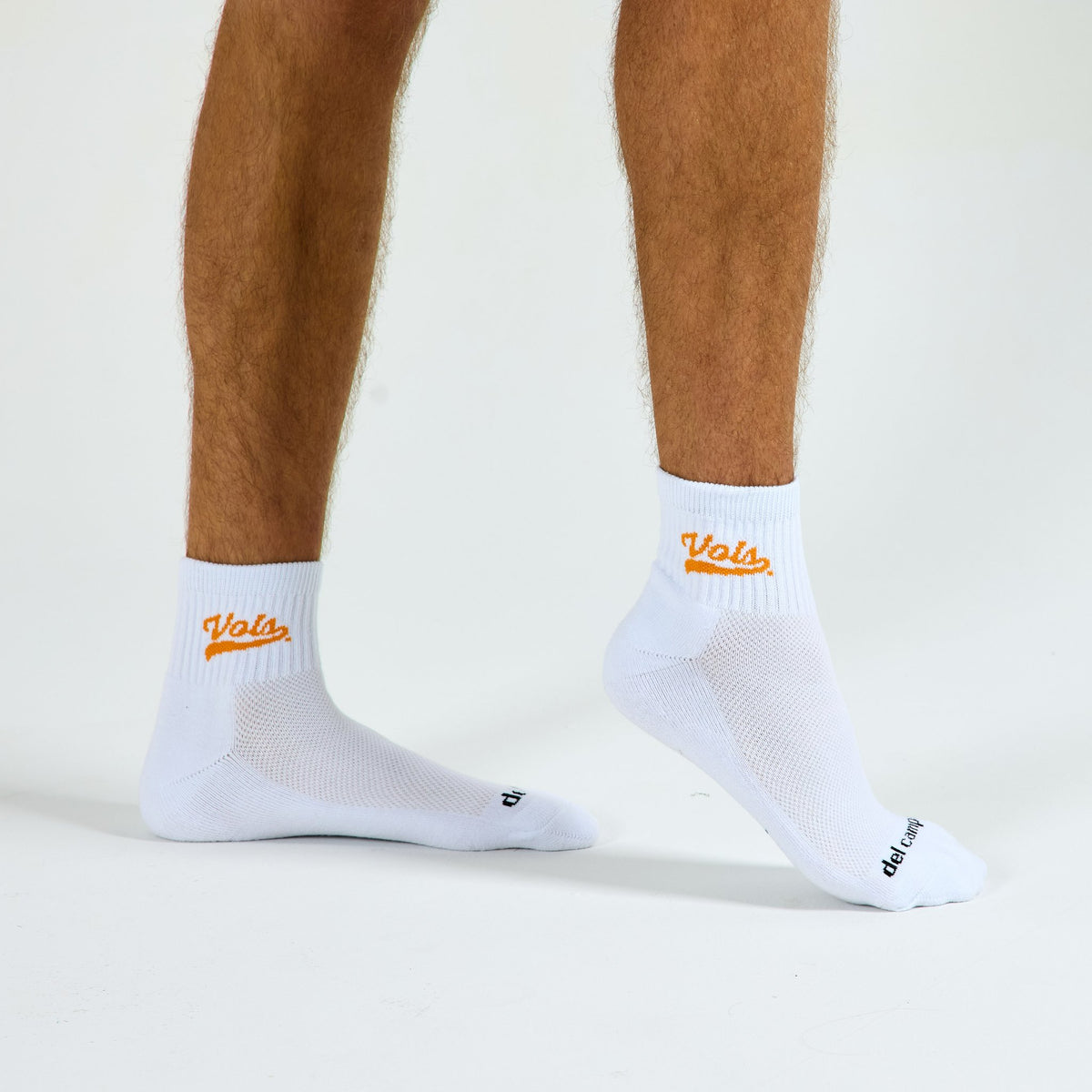 Man wearing Del Campo Tennessee Script golf socks, studio shot, no shoes