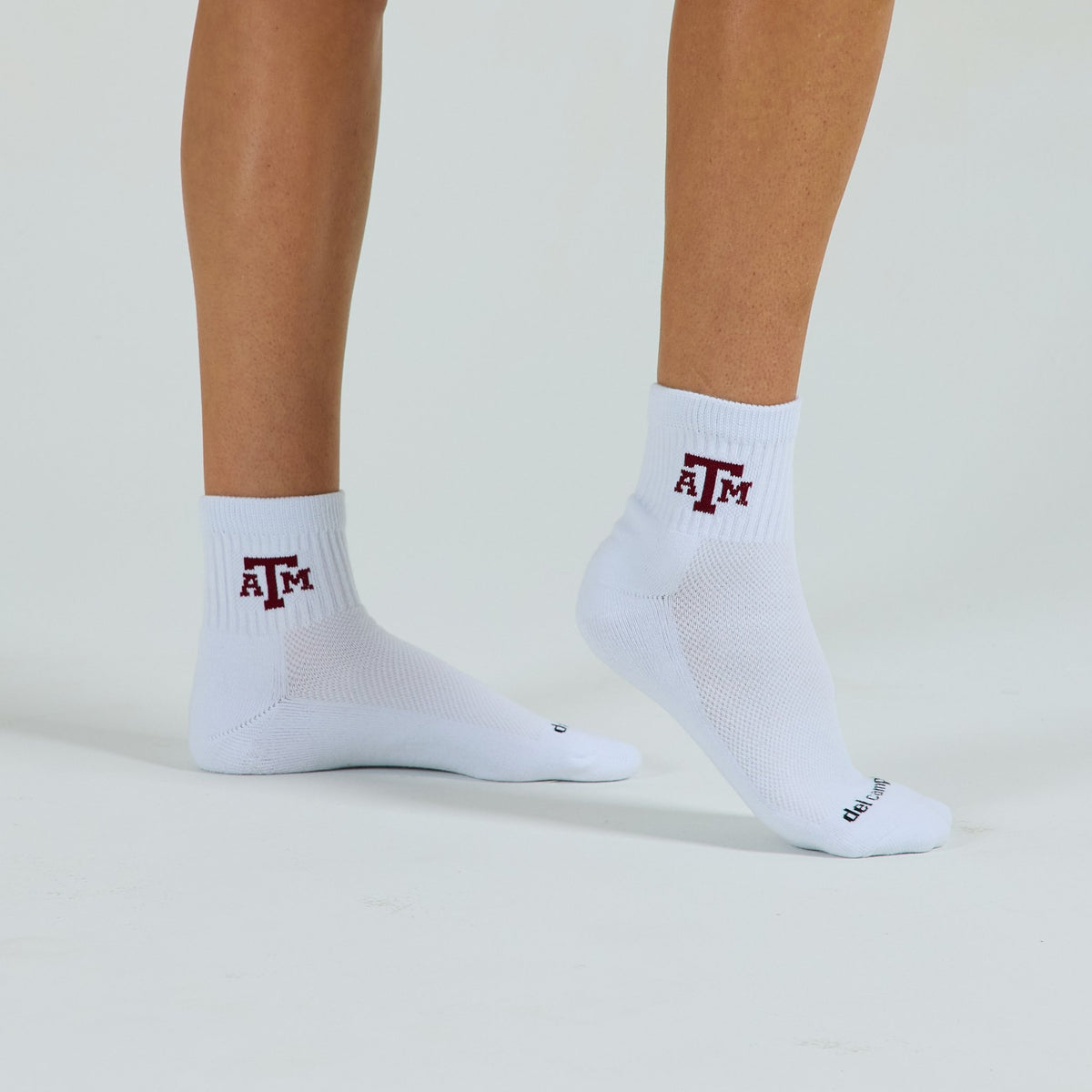 Man wearing Del Campo Texas A&M Aggies golf socks, studio shot, no shoes