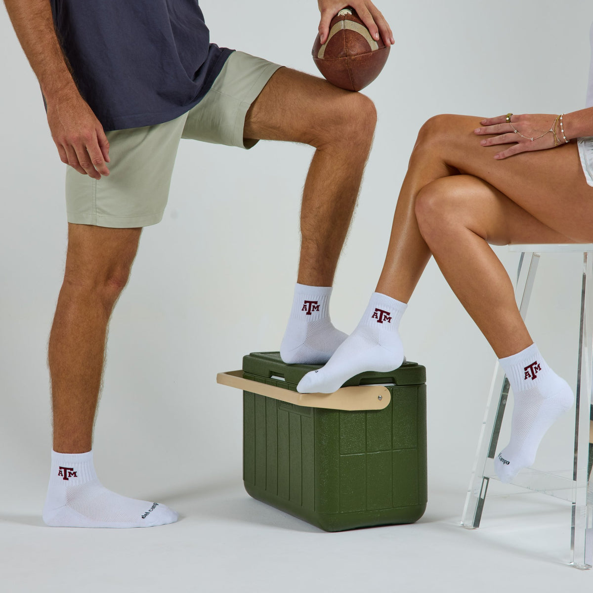 Two models wearing Del Campo Texas A&M Aggies golf socks in studio