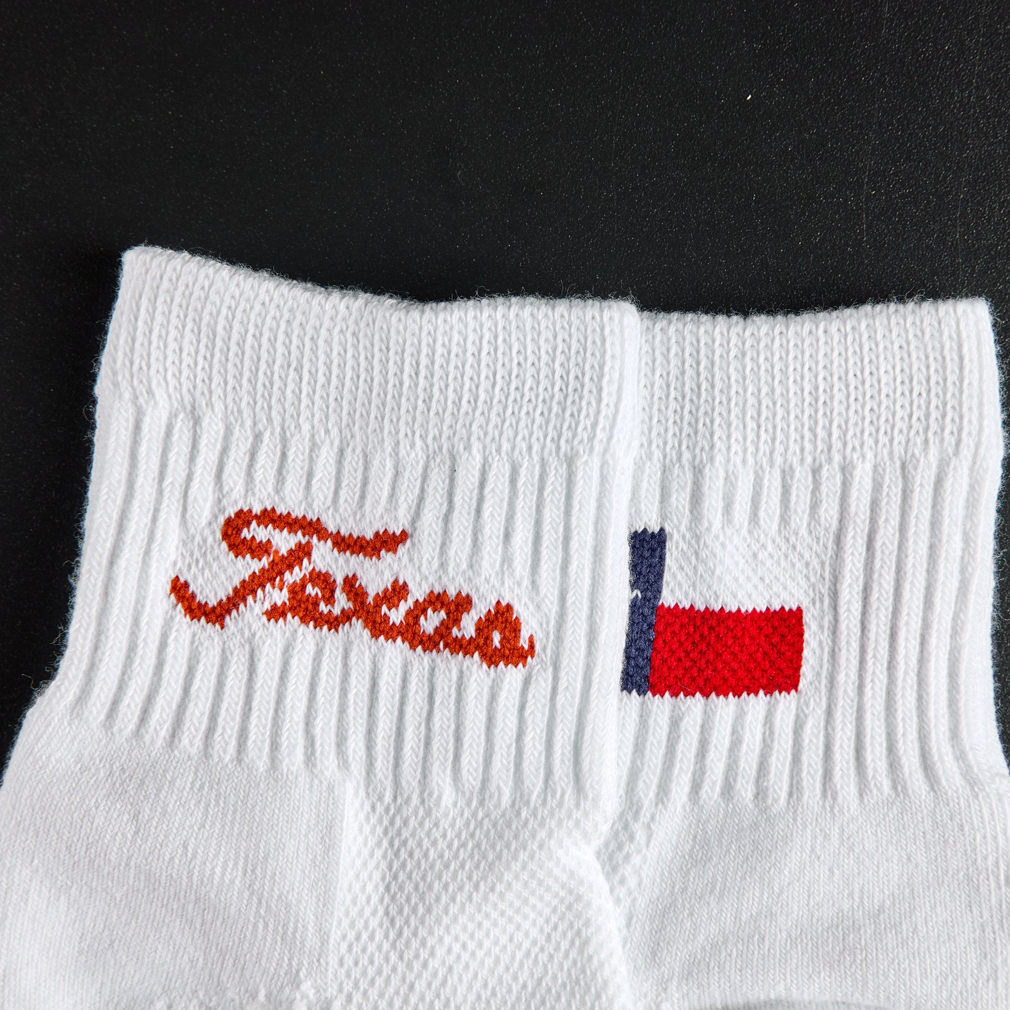 Close-up of the burnt orange Texas script wordmark on Del Campo Texas Longhorns Pack golf socks