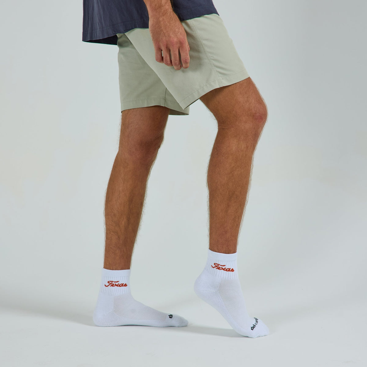 Del Campo Texas Longhorns Script golf socks on a male model in studio