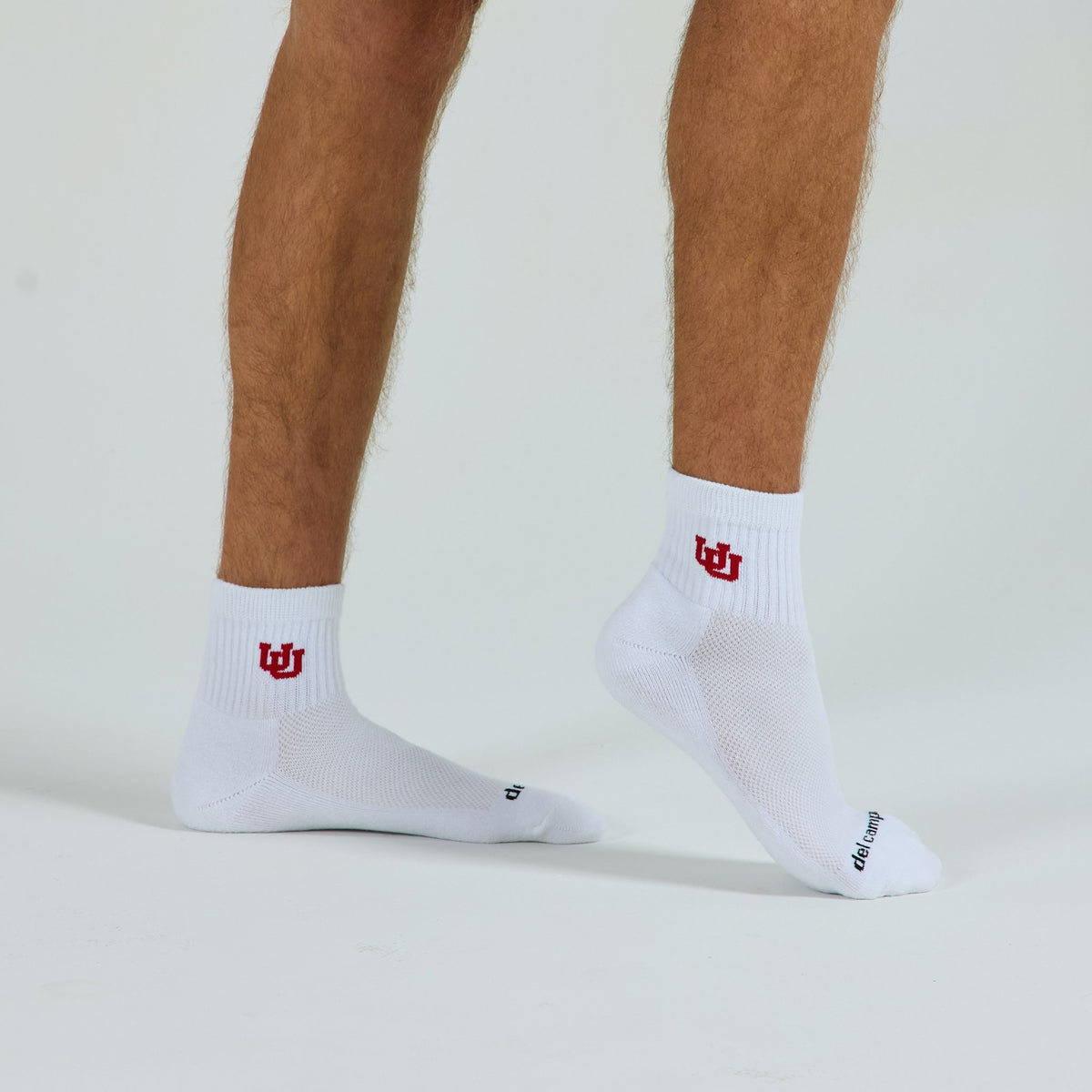 Del Campo Utah Utes golf socks on a male model in studio