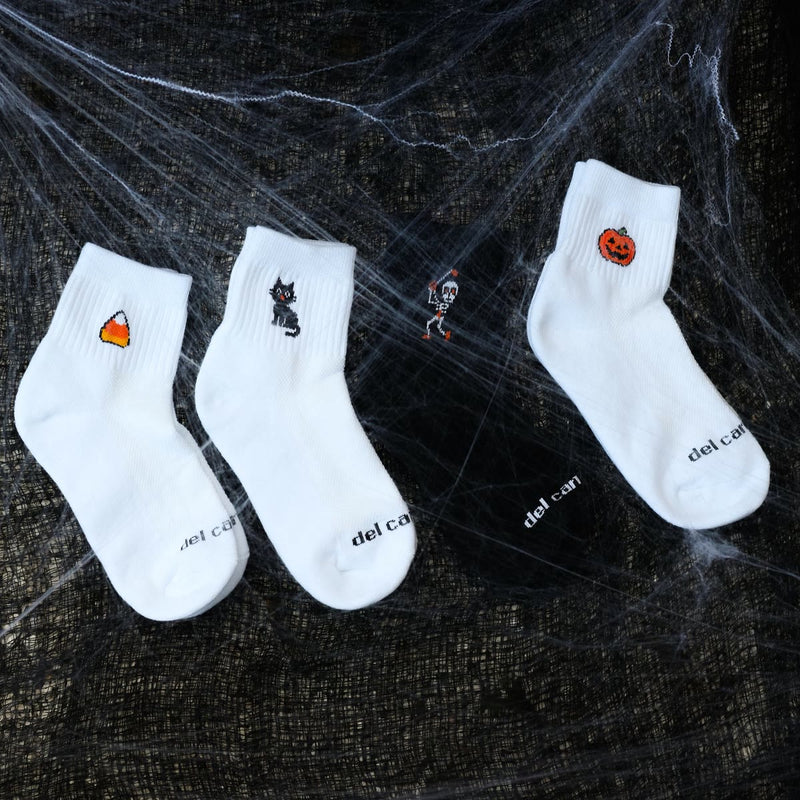 Candy Corn, Black Cat and Jack-O'-Lantern socks on a spiderweb