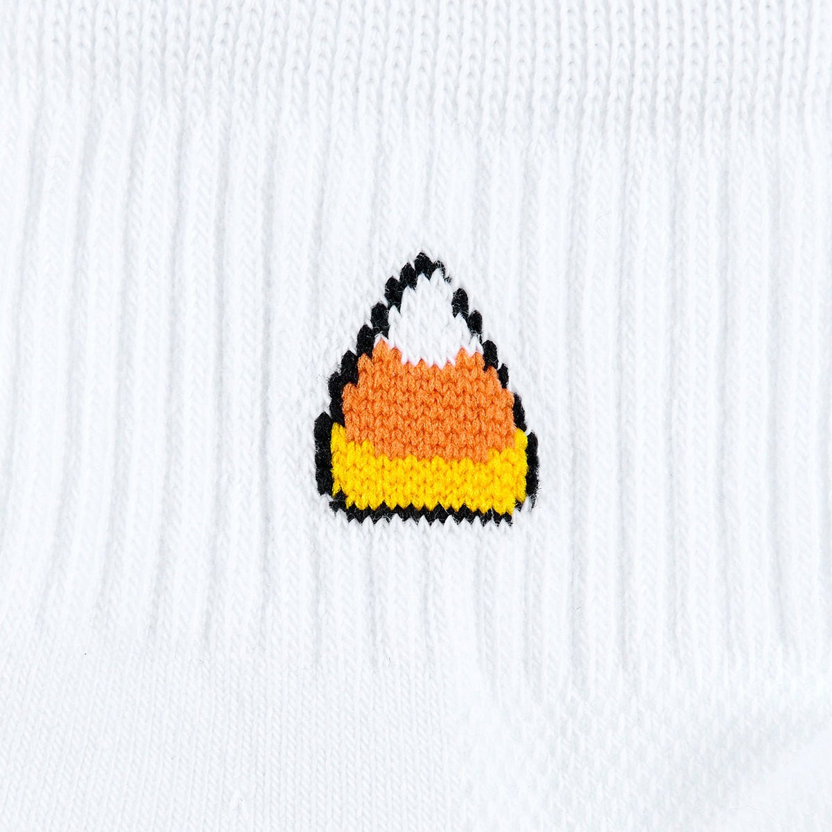 Del Campo Candy Corn Halloween golf socks, white quarter socks with a knit candy corn on the cuff, close-up of the knit candy corn