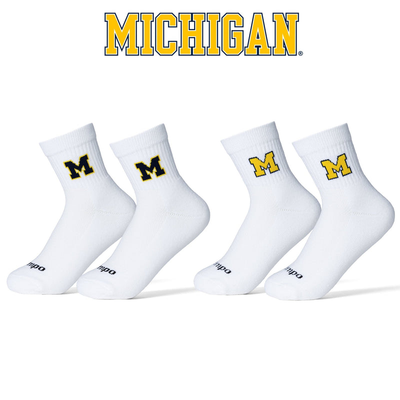 Four white crew socks with Michigan Wolverines M logo in yellow and blue. | product, college