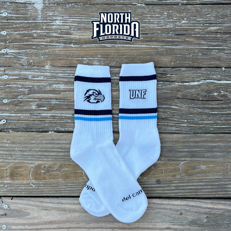 North Florida Ospreys Swoop golf socks in white with navy and blue stripes and UNF logo. | product, college