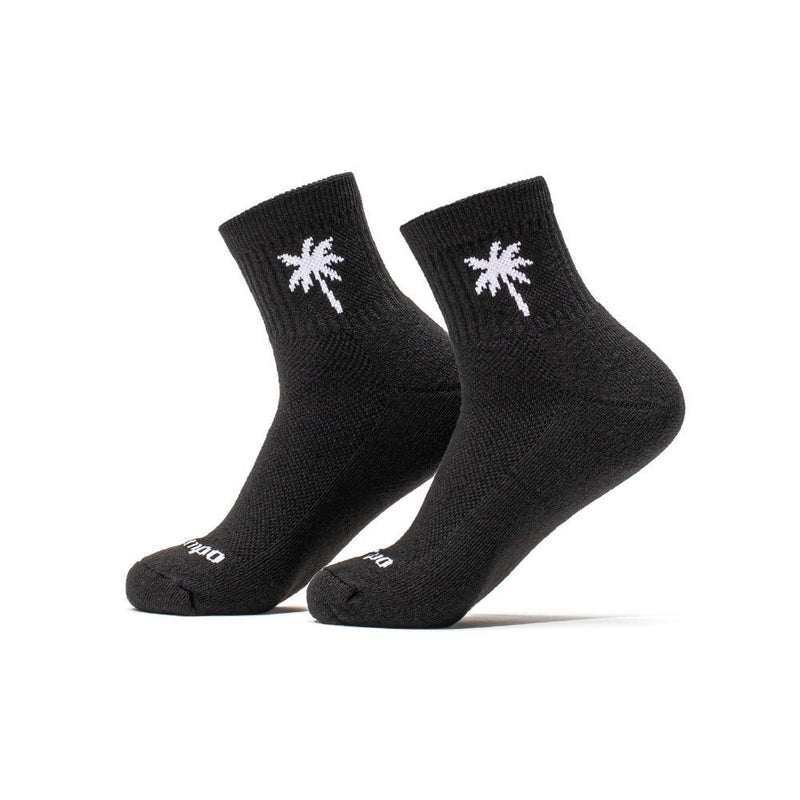 Pair of black Del Campo Golf socks with white palm tree logo on white background | product