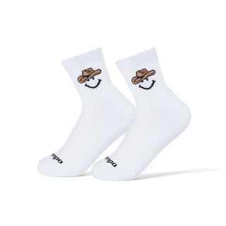 Del Campo Cowboy Smiley golf socks worn on a pair of feet
