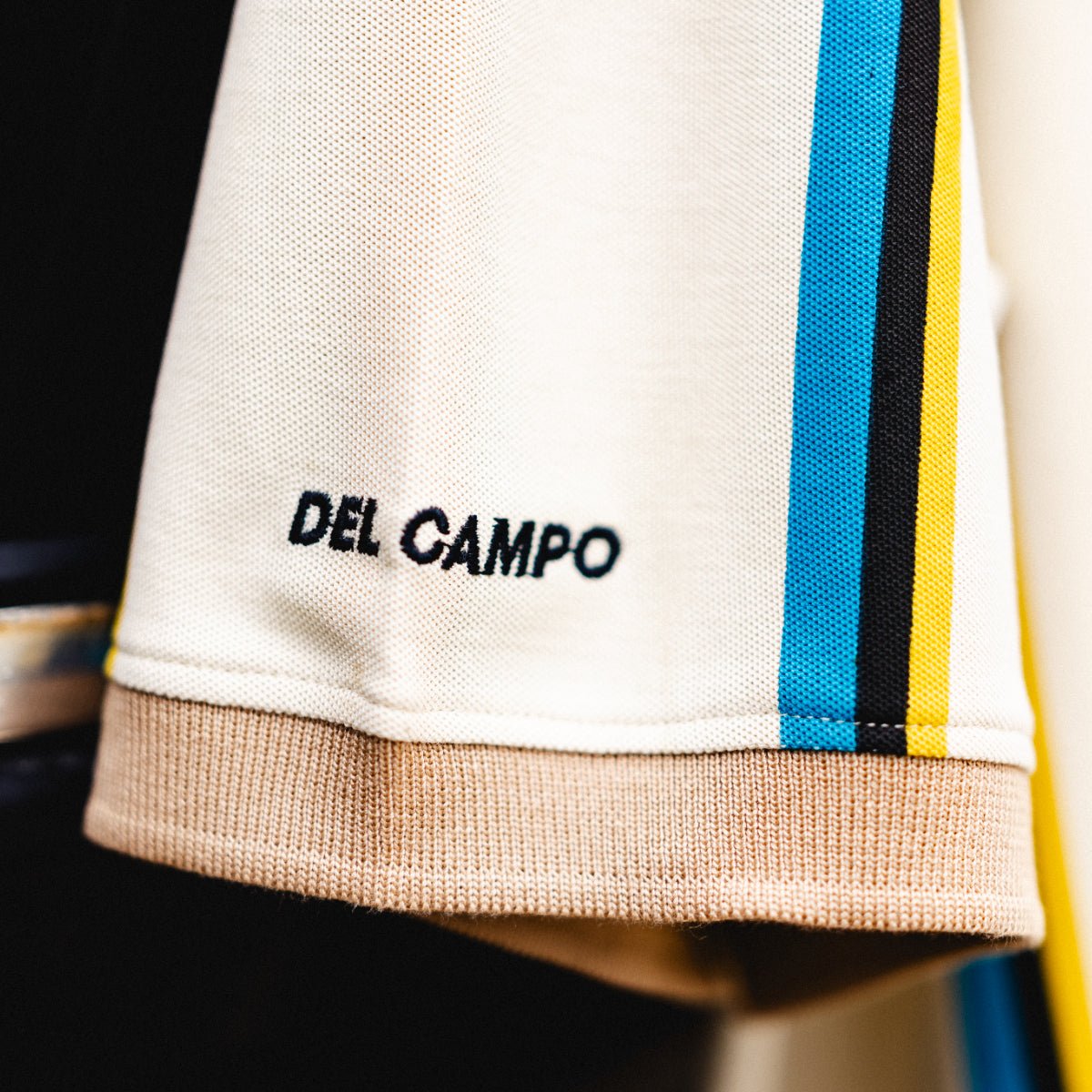 Lot J Polo, officially licensed Jacksonville Jaguars cream polo with teal and gold stripes by Del Campo