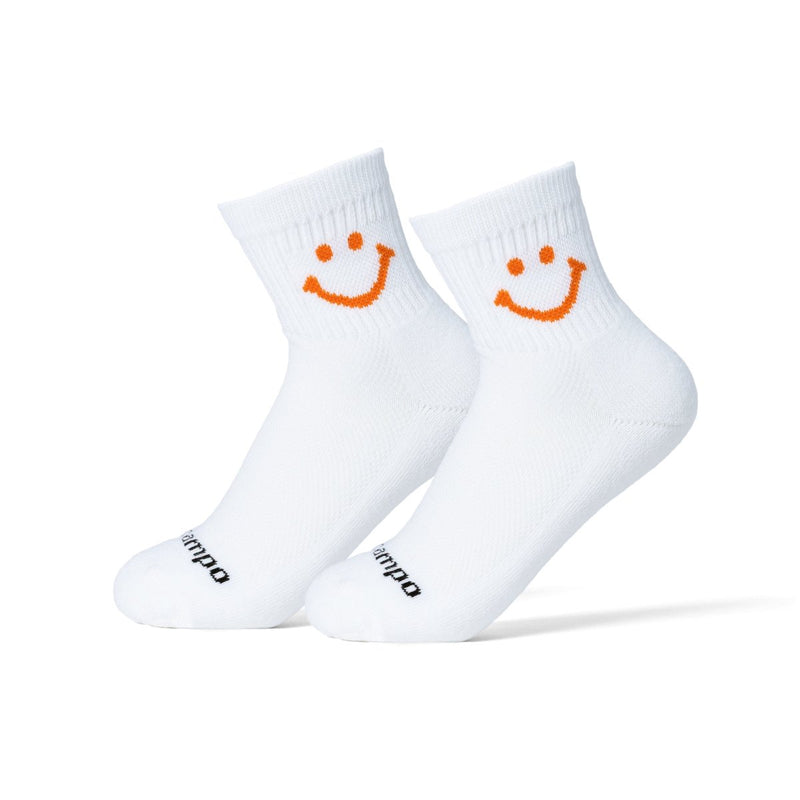 Del Campo Golf The Smiley white crew socks with orange smiley face design. | product