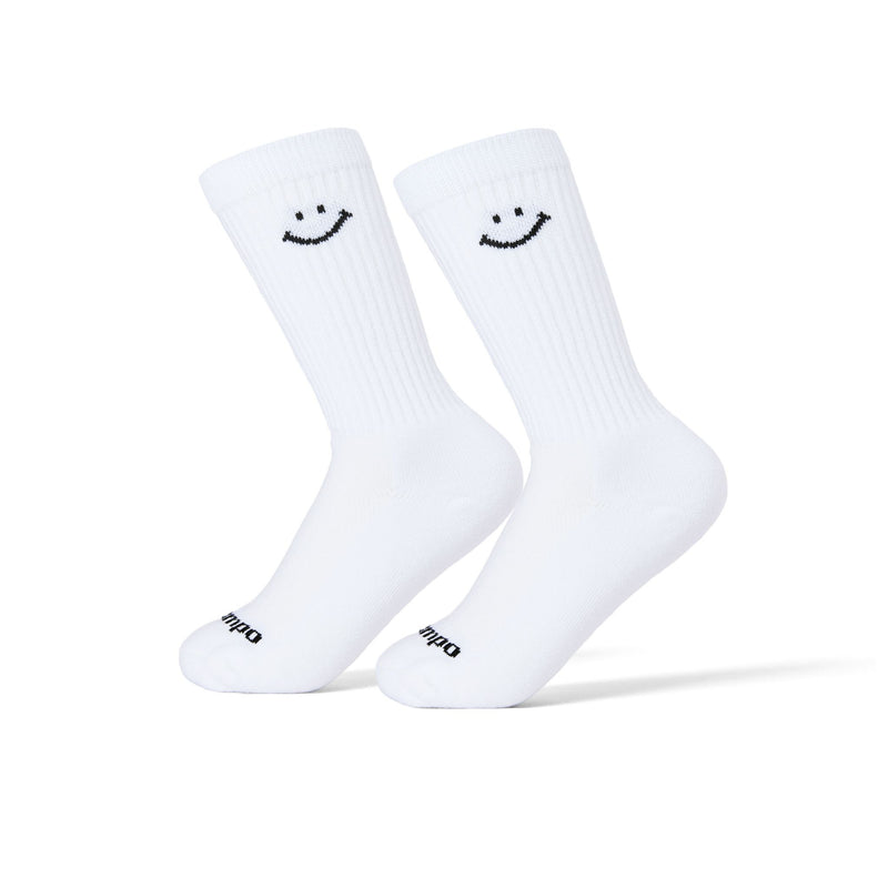 White Smiley Crew golf socks with black smiley face design on calf. | product
