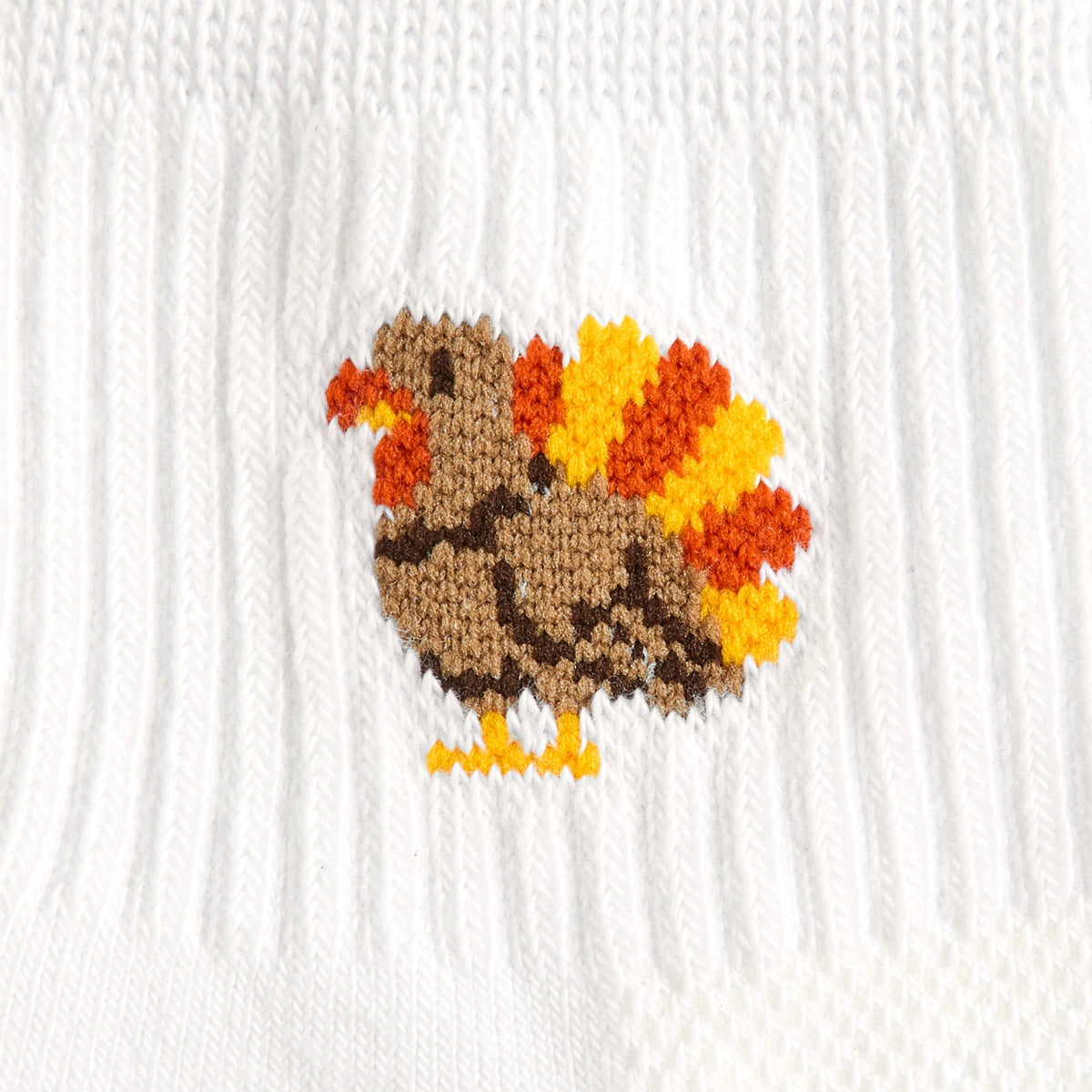 Del Campo Turkey Boys Thanksgiving golf socks, white quarter socks with a knit turkey, close-up of the knit turkey