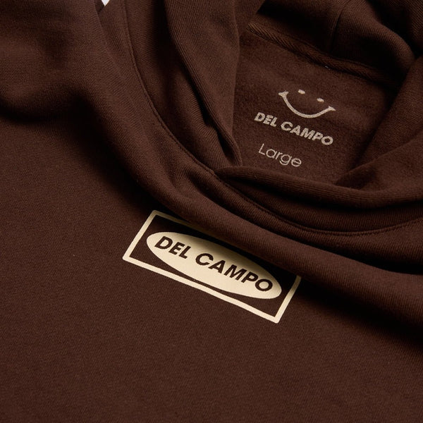 Brown Del Campo Clubhouse Hoodie with smiley logo and woven labels showing size large. | product, detail
