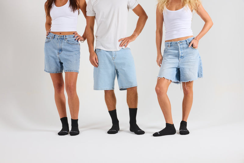 Three people in black Del Campo blank socks