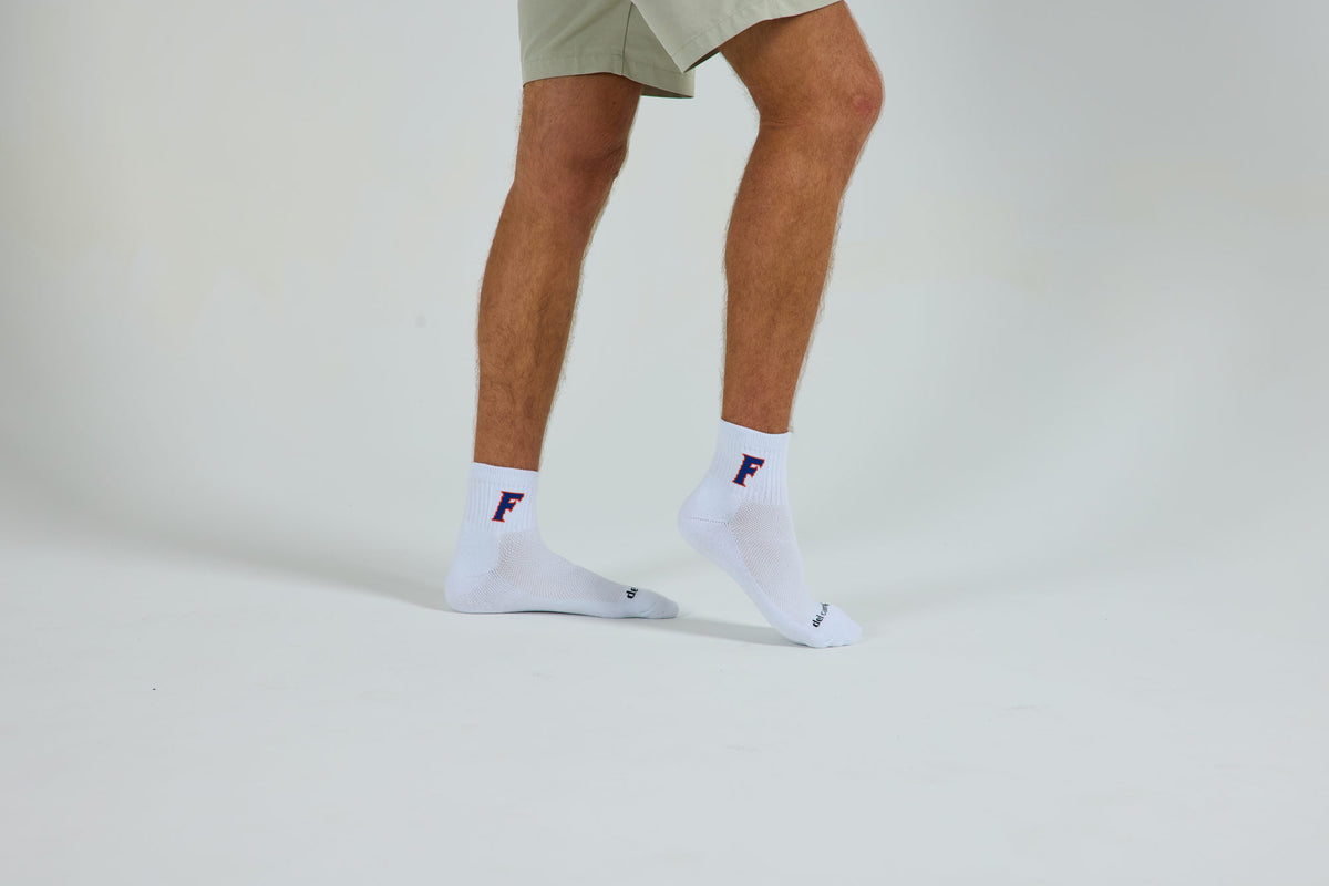 Officially licensed Del Campo Florida Gators socks being worn.