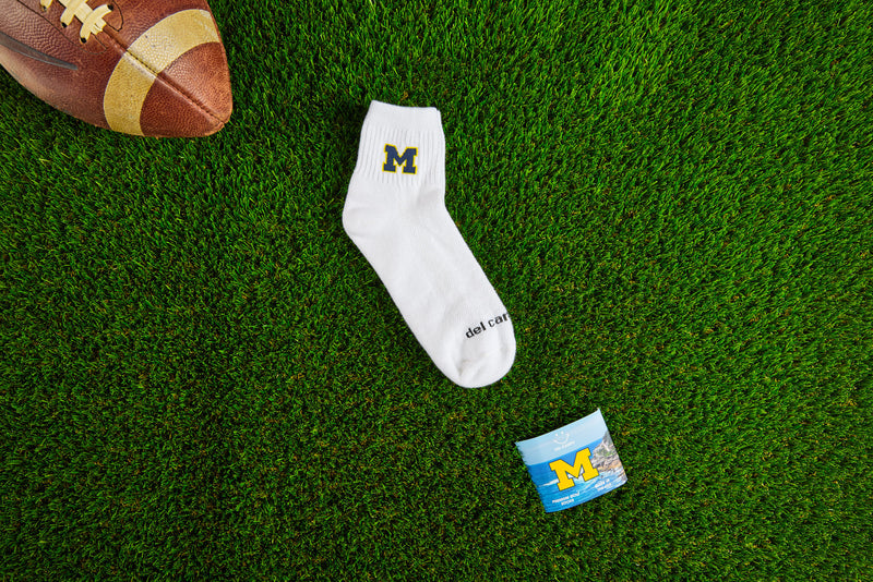 Close up of officially licensed Del Campo Michigan Wolverines golf socks.