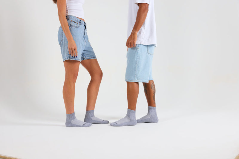 Two people in grey Del Campo blank socks
