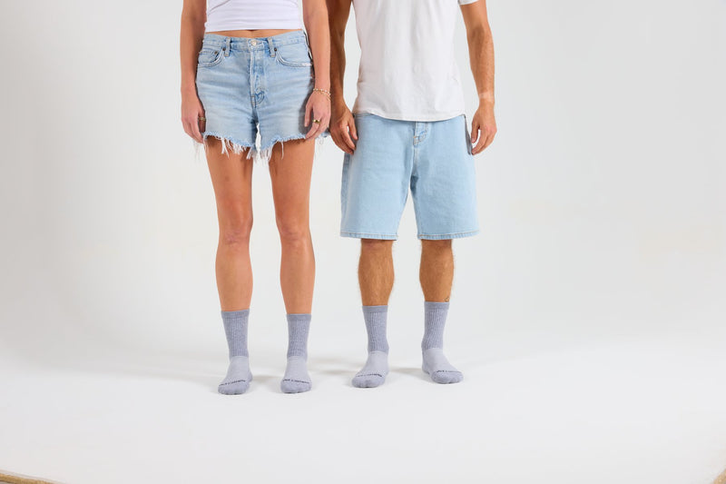 Two people in grey Del Campo blank crew socks