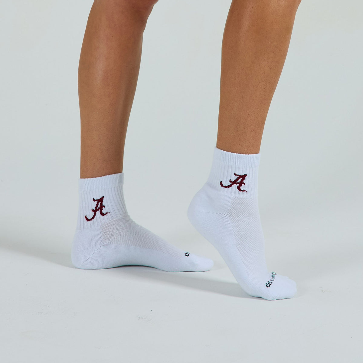 Del Campo Alabama Crimson Tide golf socks on a female model in studio