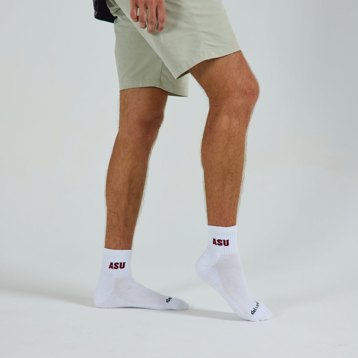 Man wearing Del Campo Arizona State Sun Devils golf socks, studio shot, no shoes