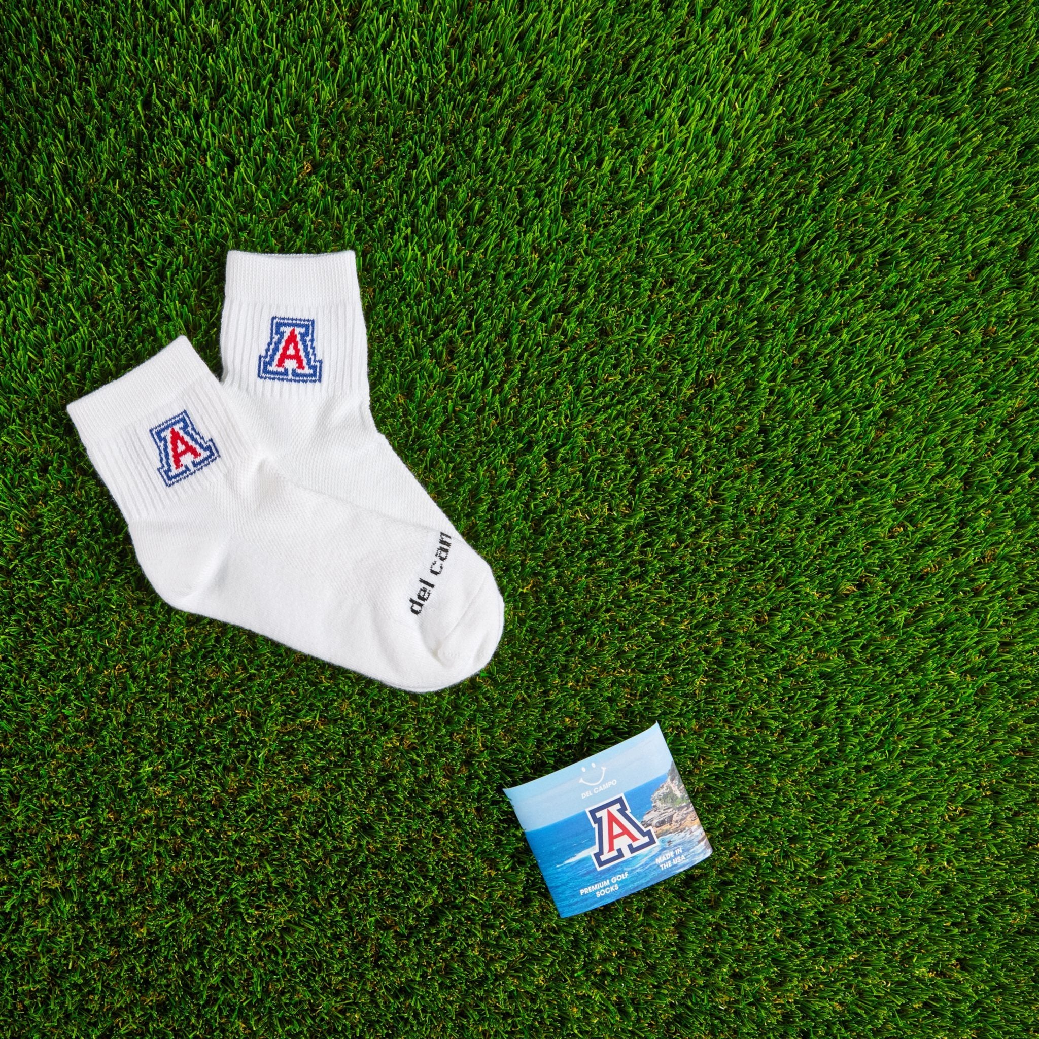 Del Campo Arizona Wildcats golf socks on turf with a team pennant