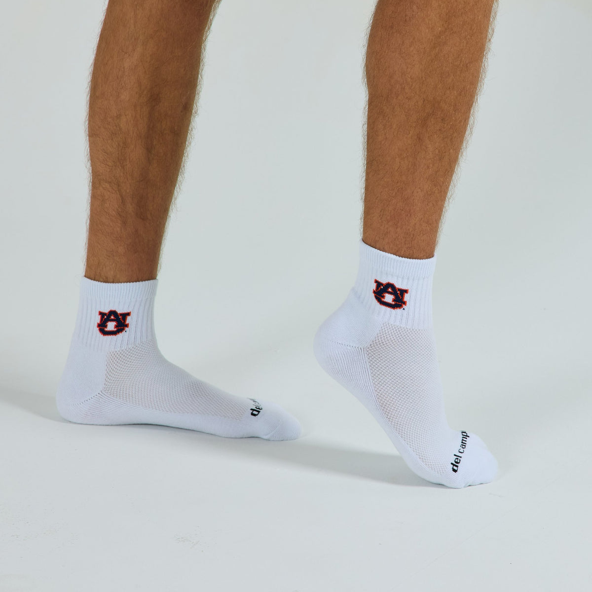 Man wearing Del Campo Auburn War Eagle golf socks, studio shot, no shoes