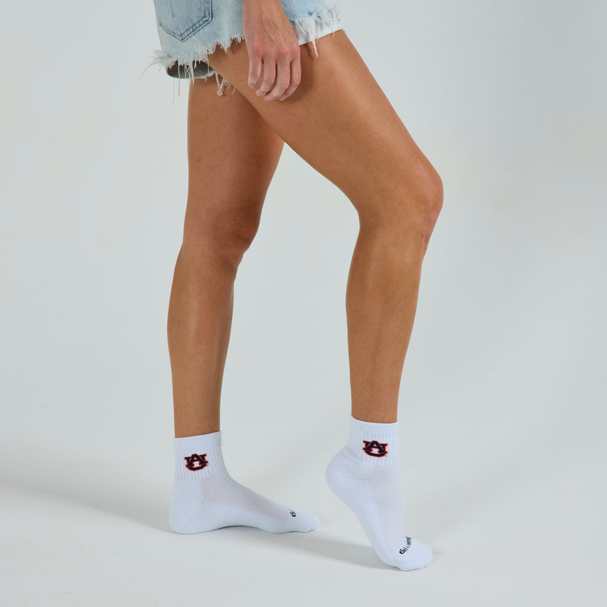 Del Campo Auburn War Eagle golf socks on a female model in studio