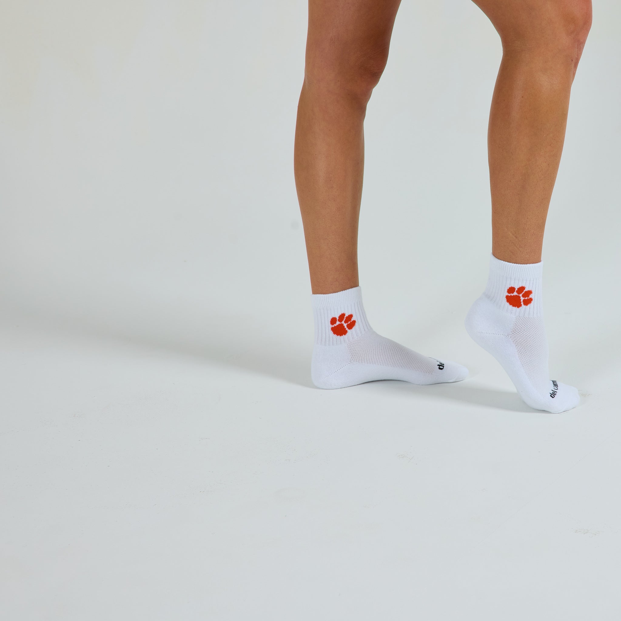 Man wearing Del Campo Clemson Tigers golf socks, studio shot, no shoes