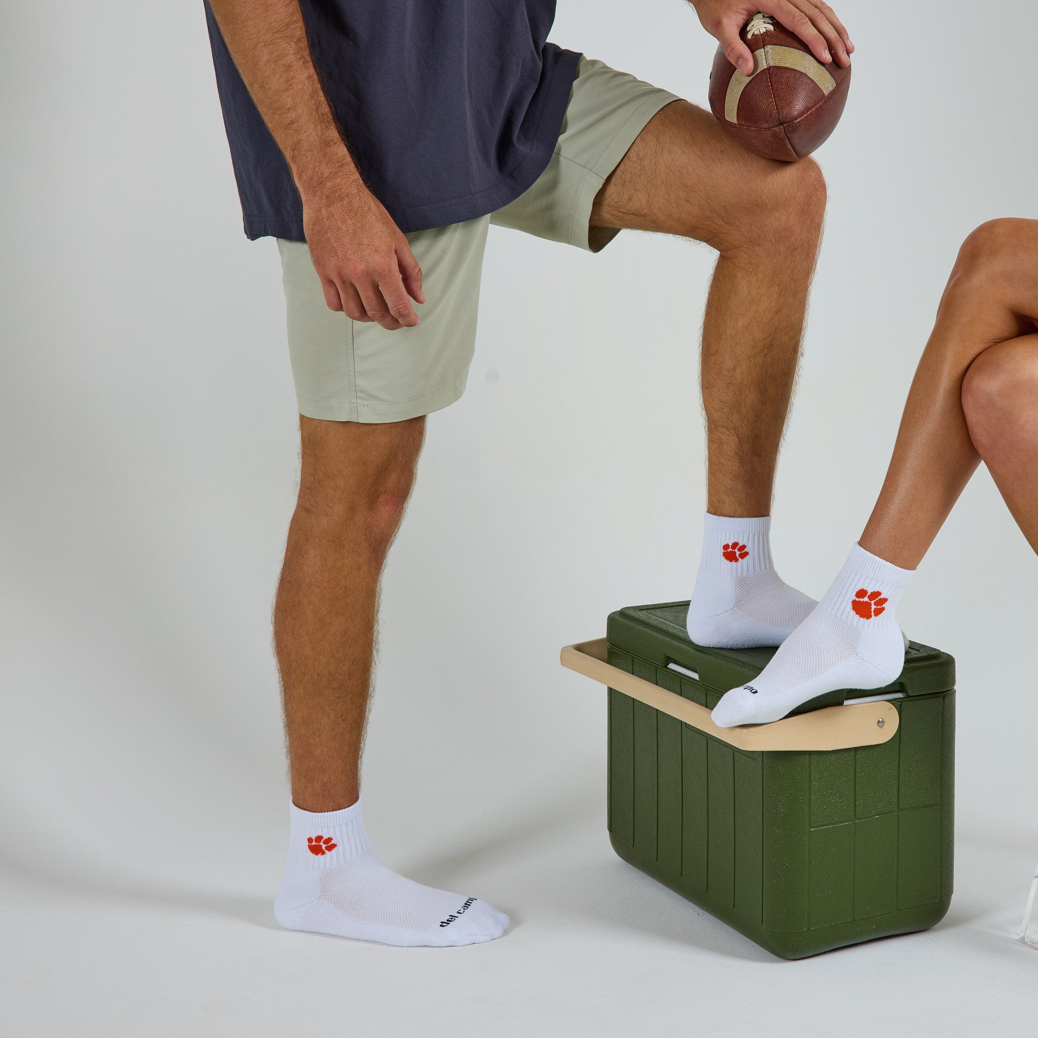 Two models wearing Del Campo Clemson Tigers golf socks in studio